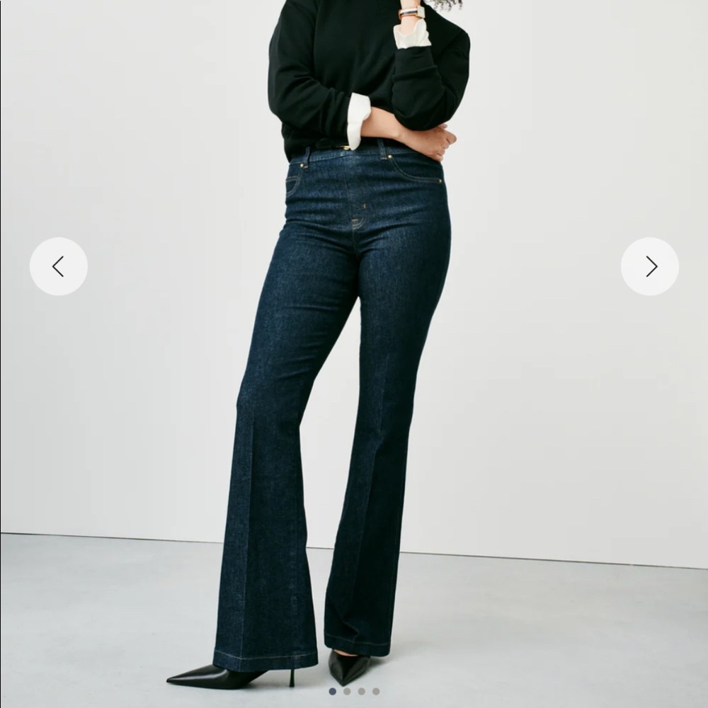 Spanx flare dark denim jeans. New w/ tags. Smooth fit from waist to knee flare.